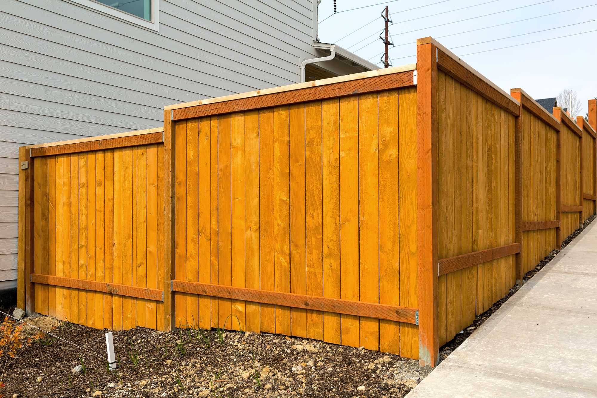 New timber fence installed along a property boundary